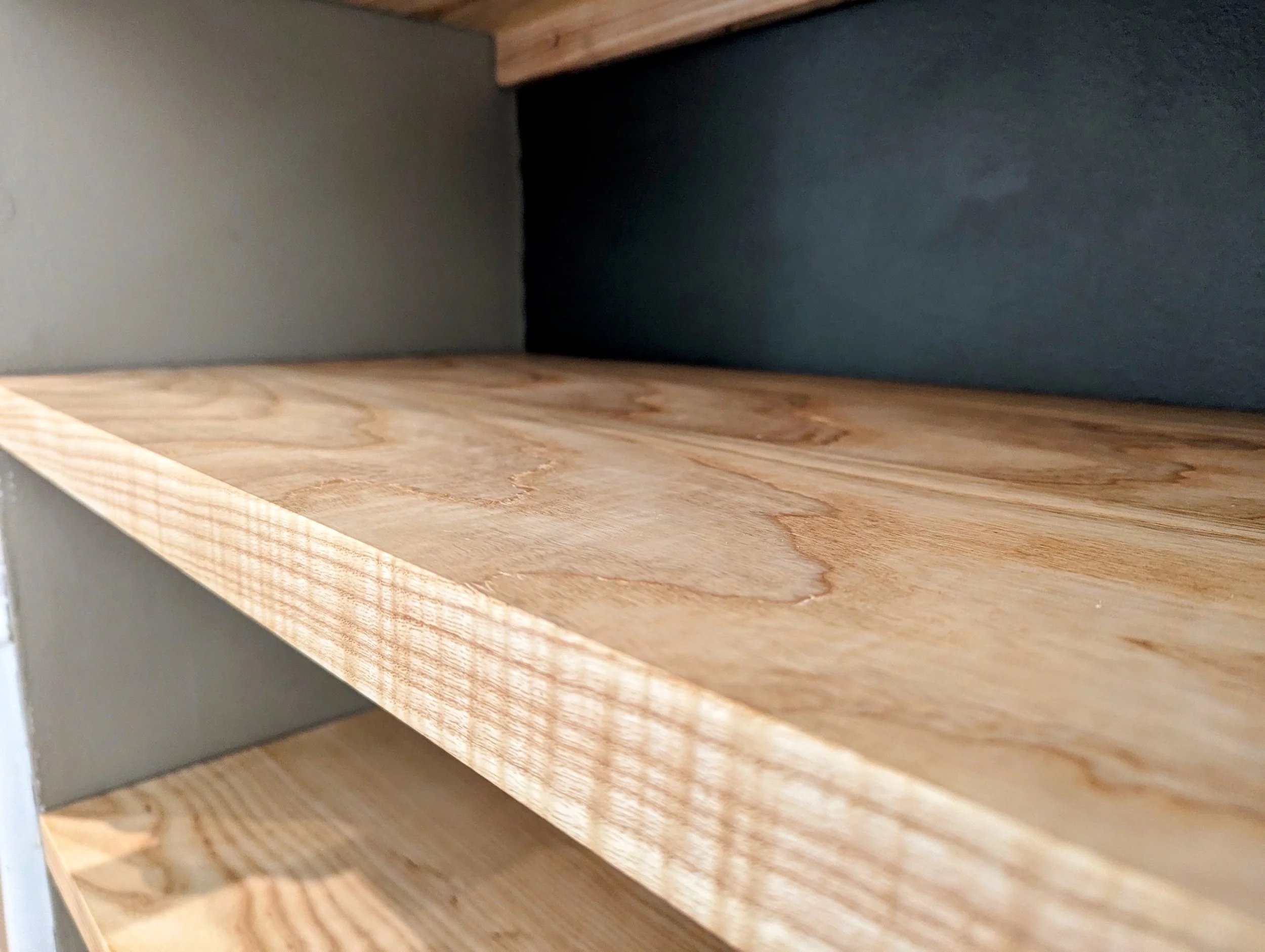 Close-up of shelf edge showing the depth of ash grain after waxing