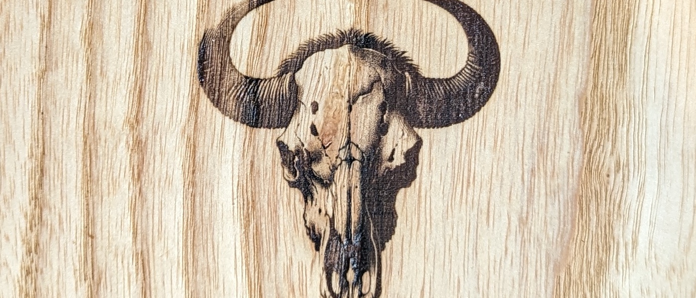 The Bisons — walnut and leather stool pair