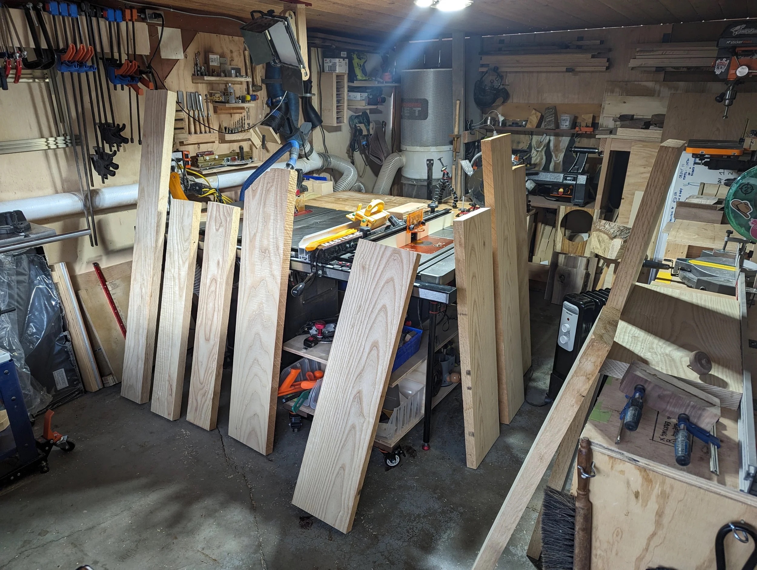 Milled ash panels standing up in the workshop