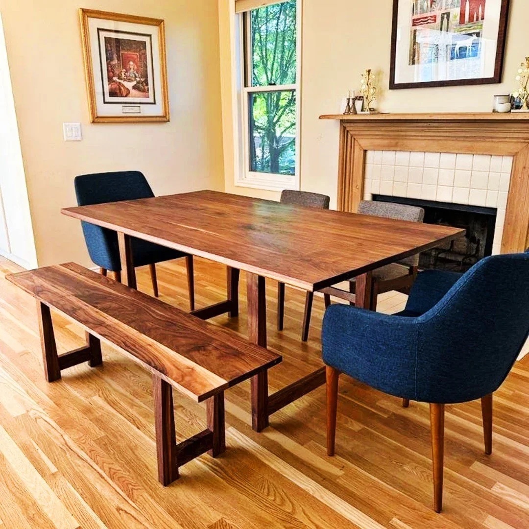 Brittney's walnut dining table and bench in her sunlit dining room