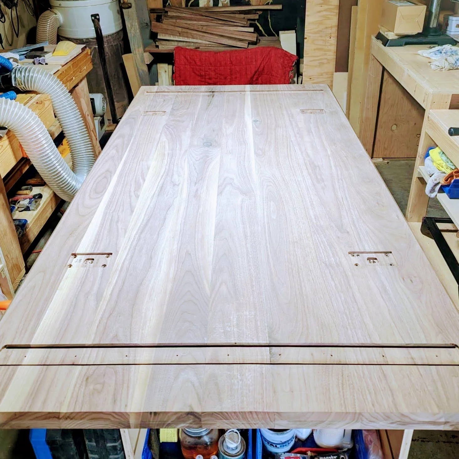 Full view of the tabletop underside showing the routed rail channel and attachment points