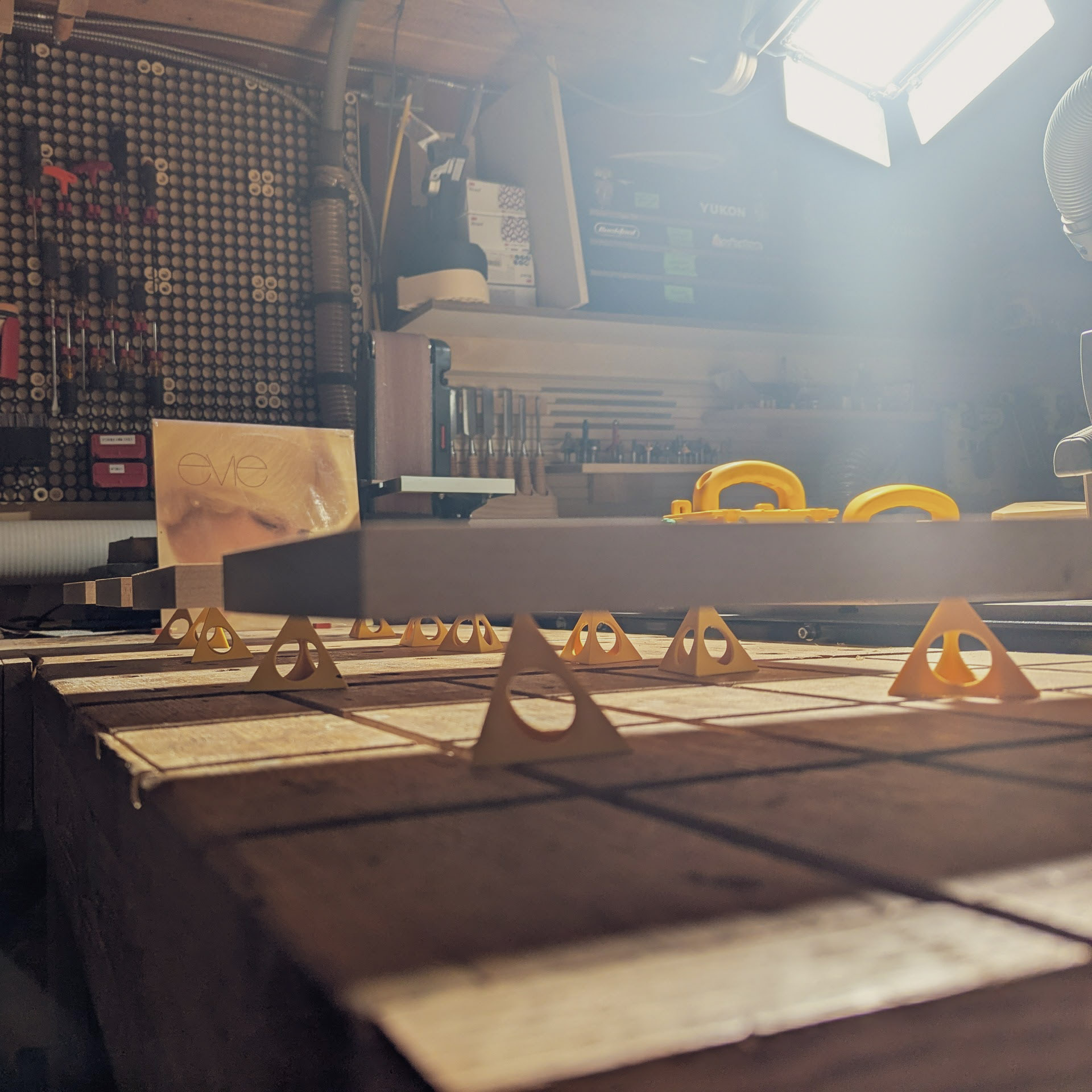 CNC work holding with triangular fixtures