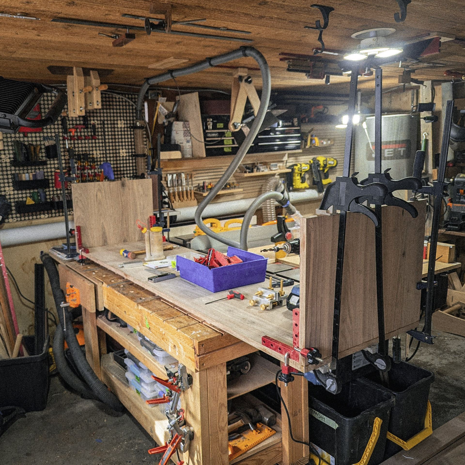 Walnut panels standing on workbench after milling