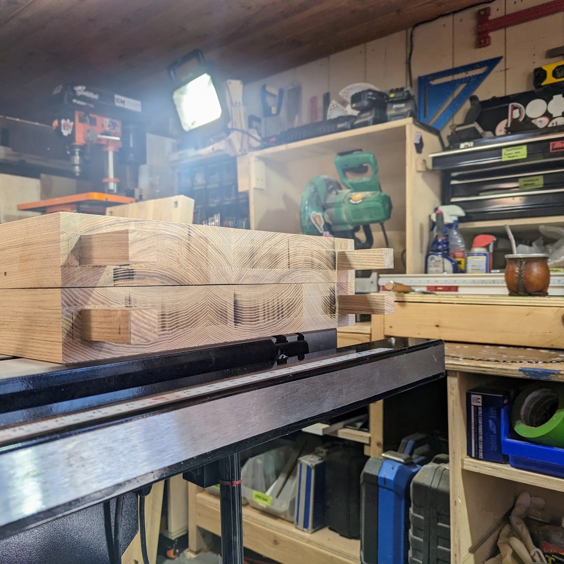 Bench in place — measuring height against kitchen island