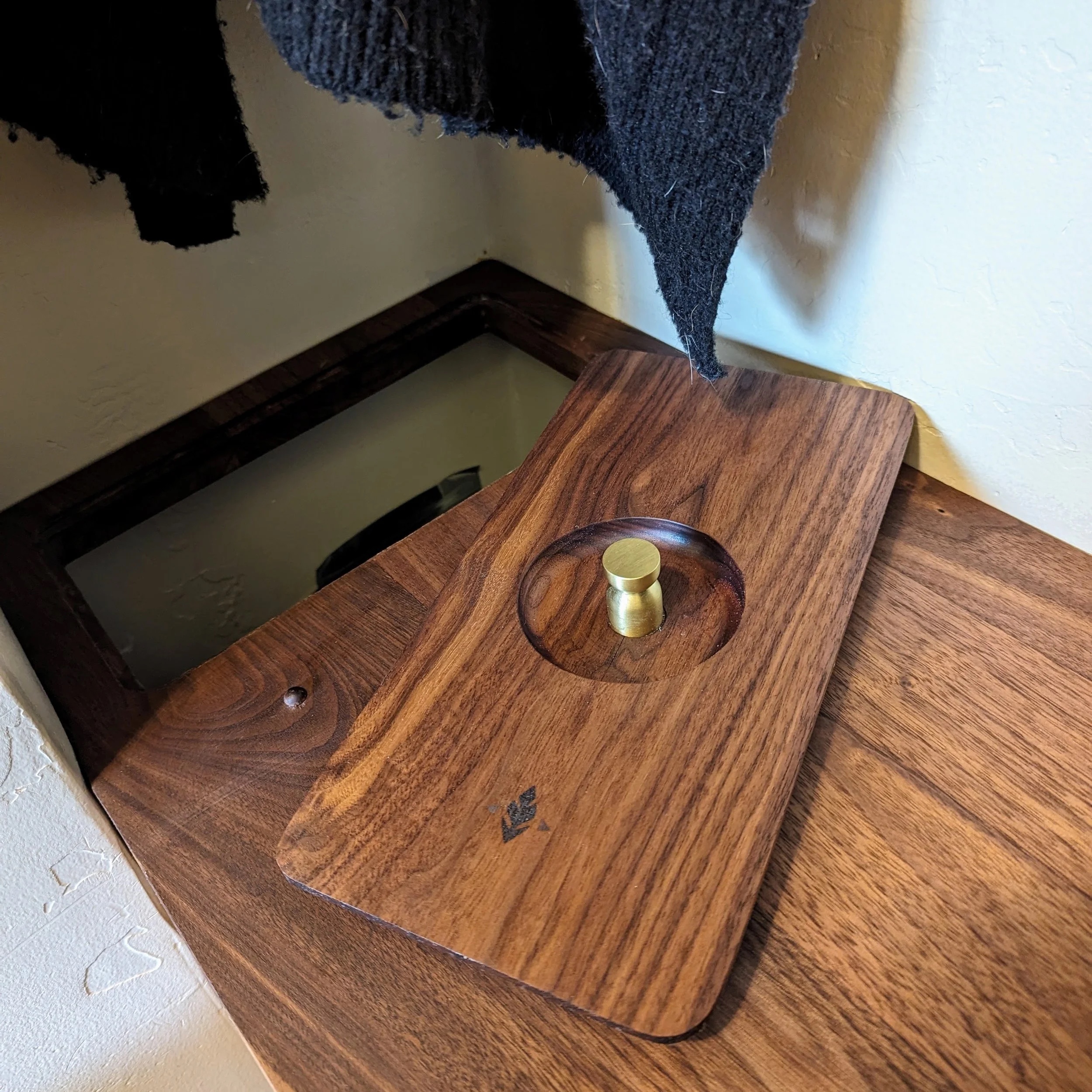 Removable walnut lid with recessed brass knob pull — ALISO feather logo engraved