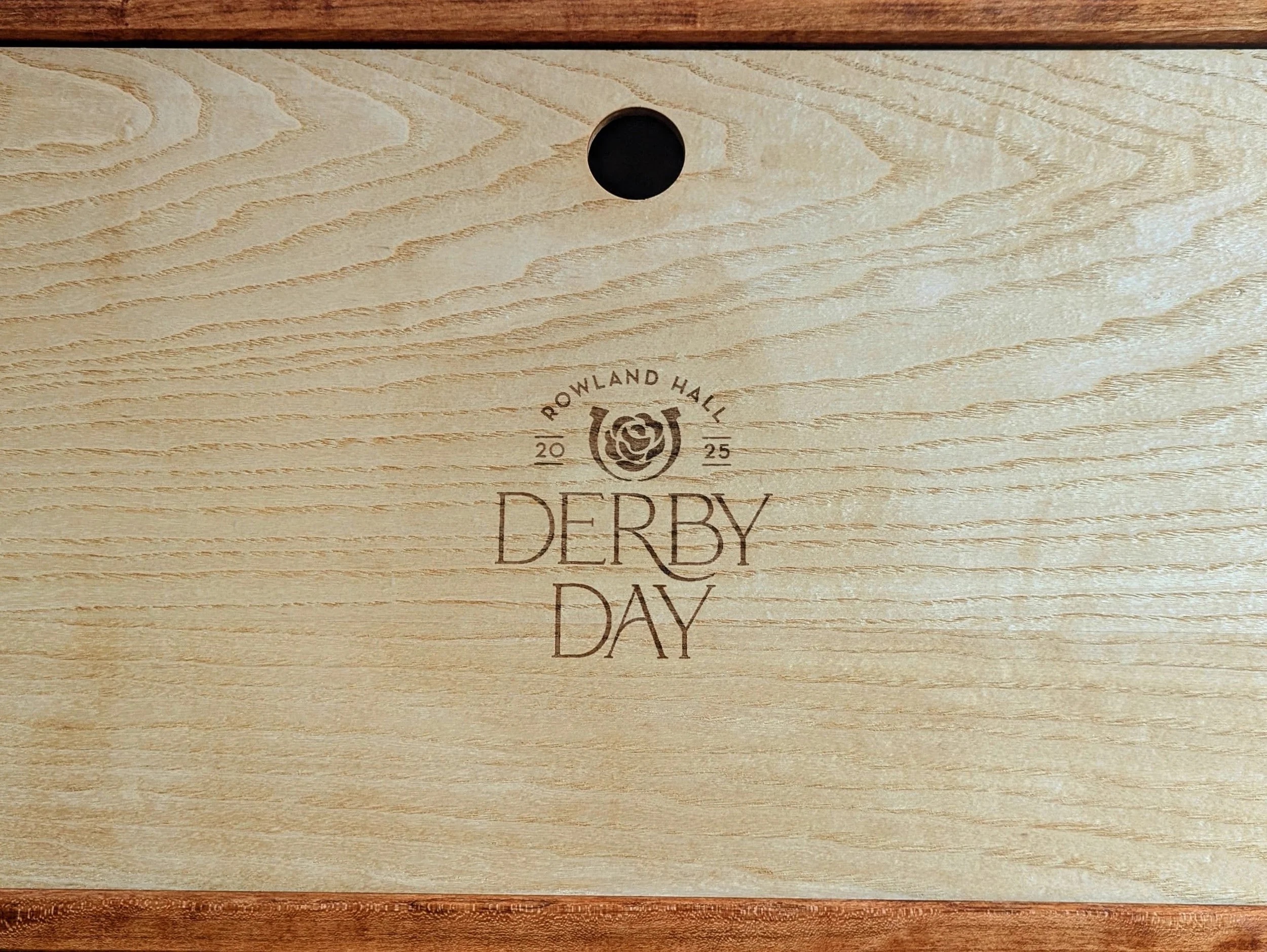 Derby Day 2025 logo laser-engraved on maple sliding lid