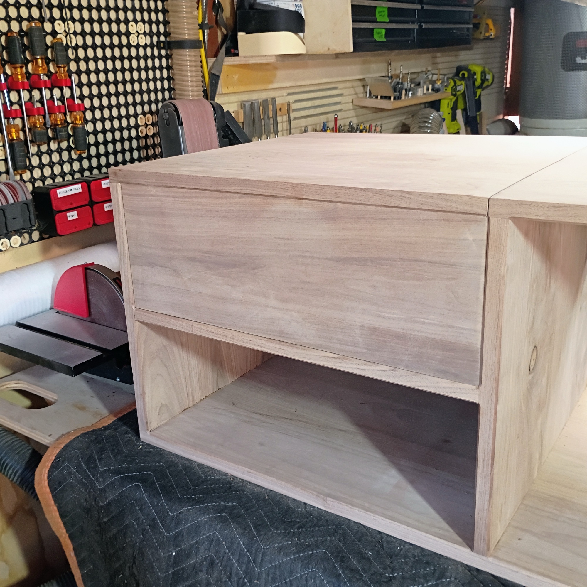 Close-up of turntable section — flip-top door fitted into the inset frame