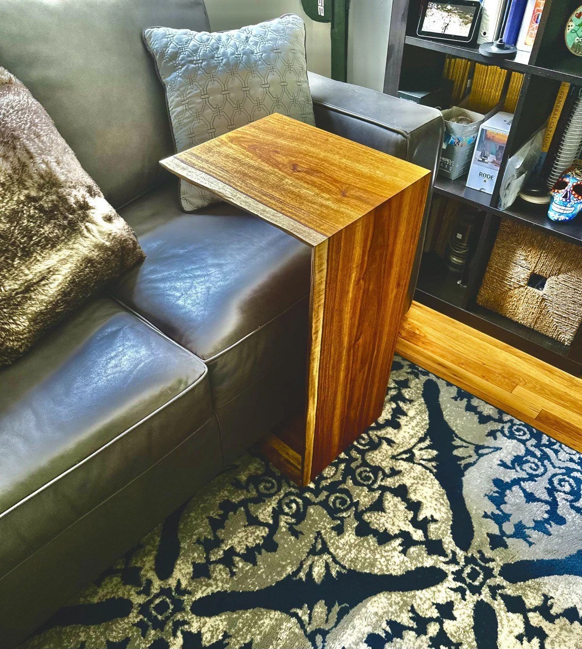 El Mesoncito in Luis's living room — canary wood glowing next to leather couch