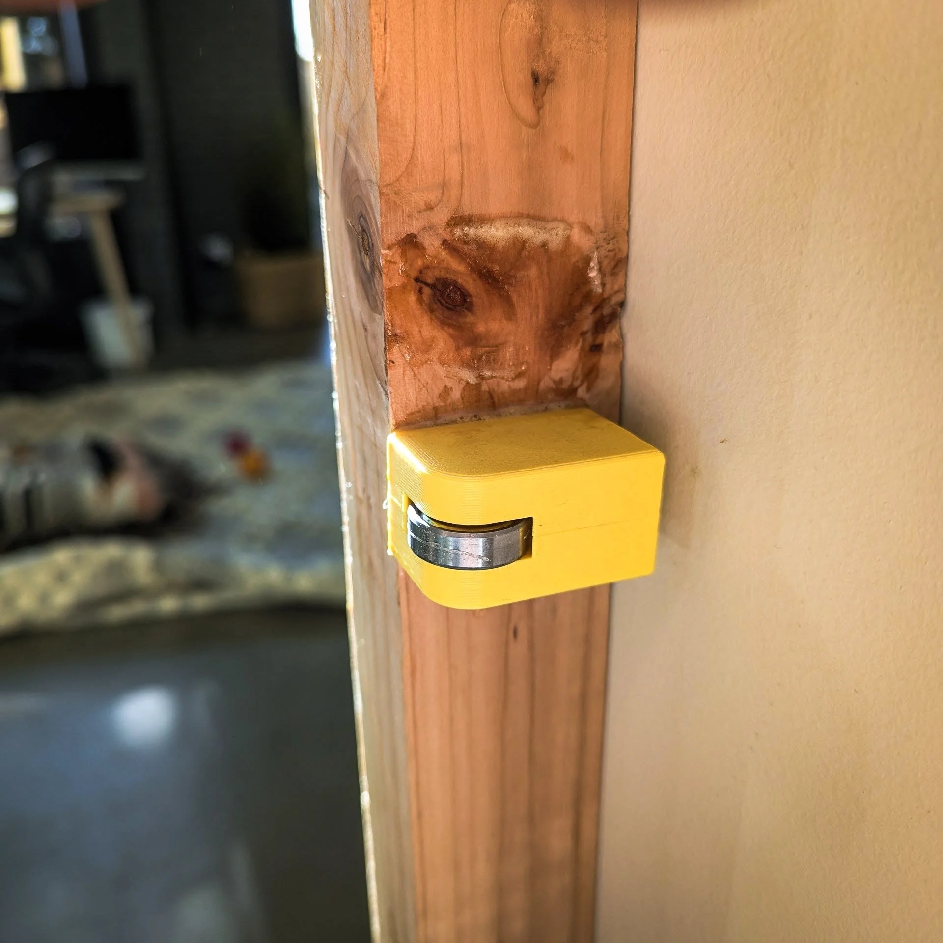 3D-printed prototype bearing mount on pine stud — testing before walnut