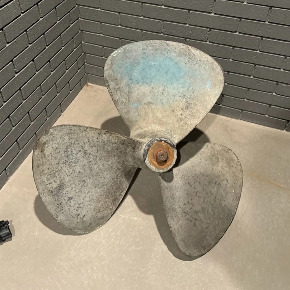 Raw unpolished propeller from above showing decades of patina