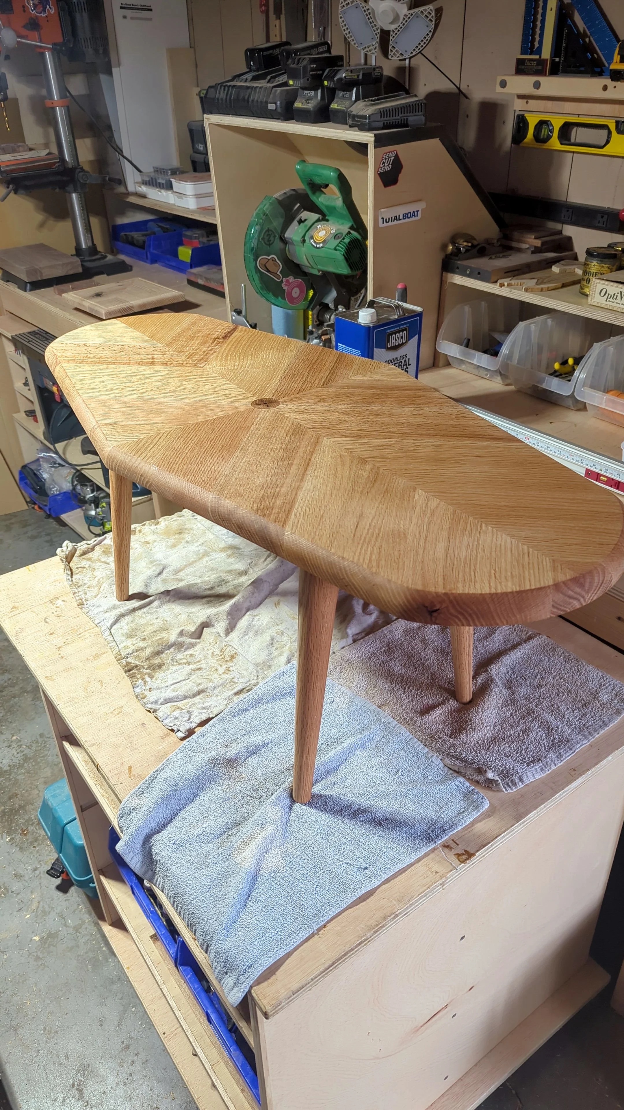 Table assembled in the workshop — unstained red oak with legs attached