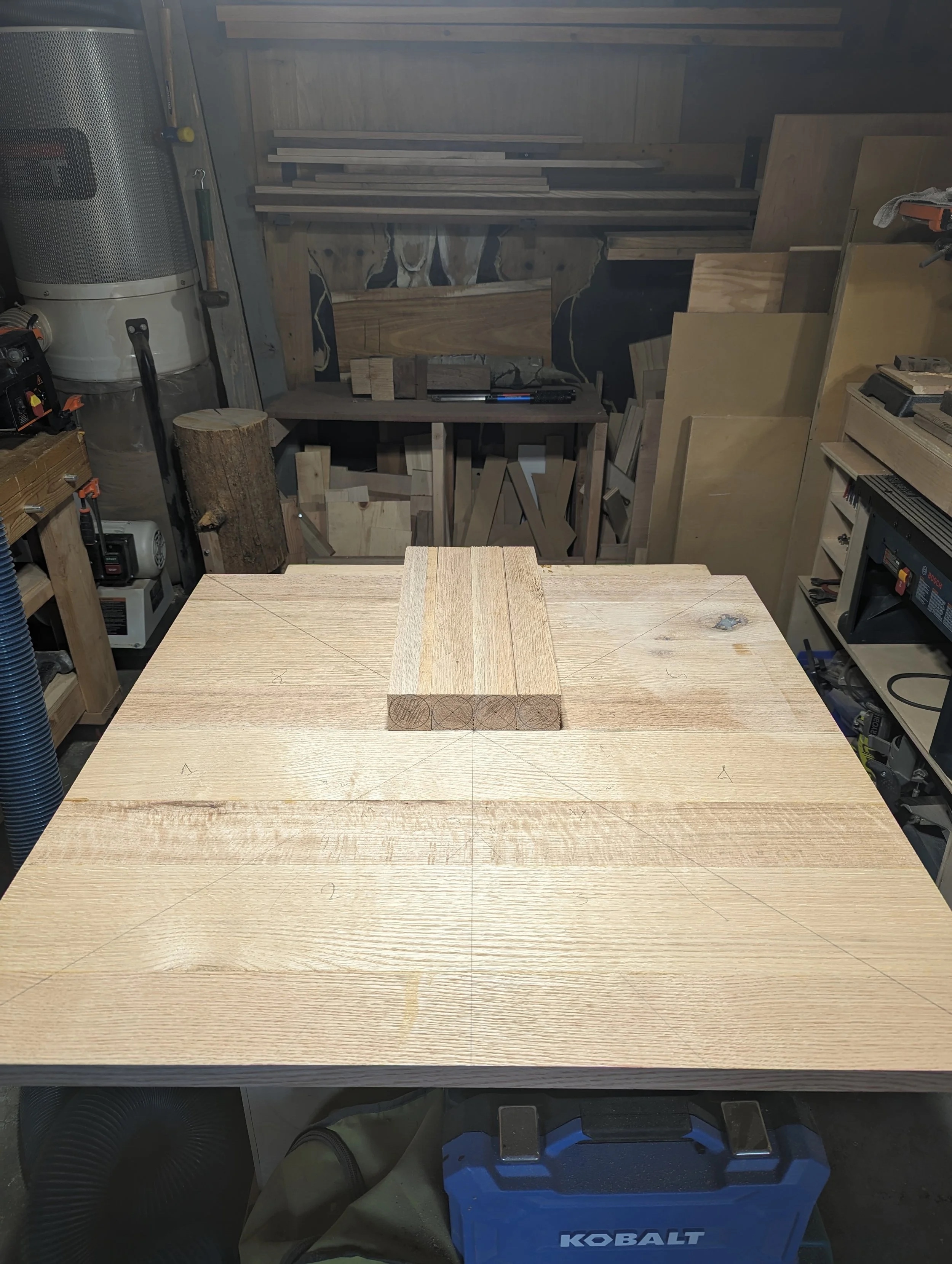 Rift-sawn red oak boards laid out with cutting lines marked