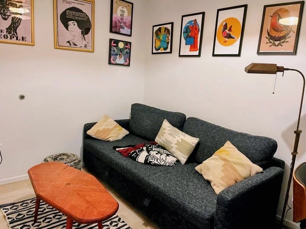 The Red Tiger in its forever home — living room with gallery wall and kilim rug