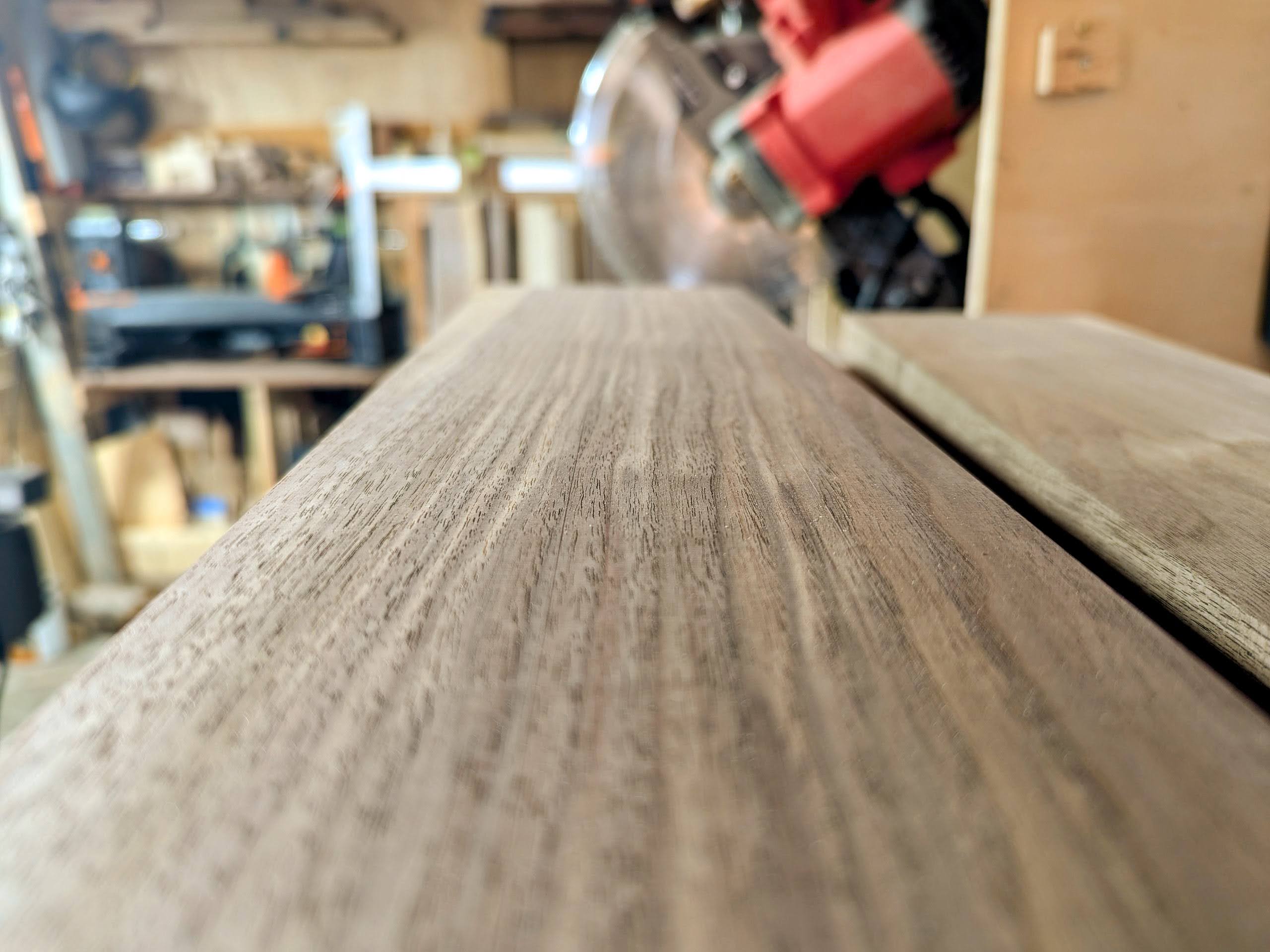 Milled walnut showing its face — grain, figure, and warmth that were hiding under rough-saw marks