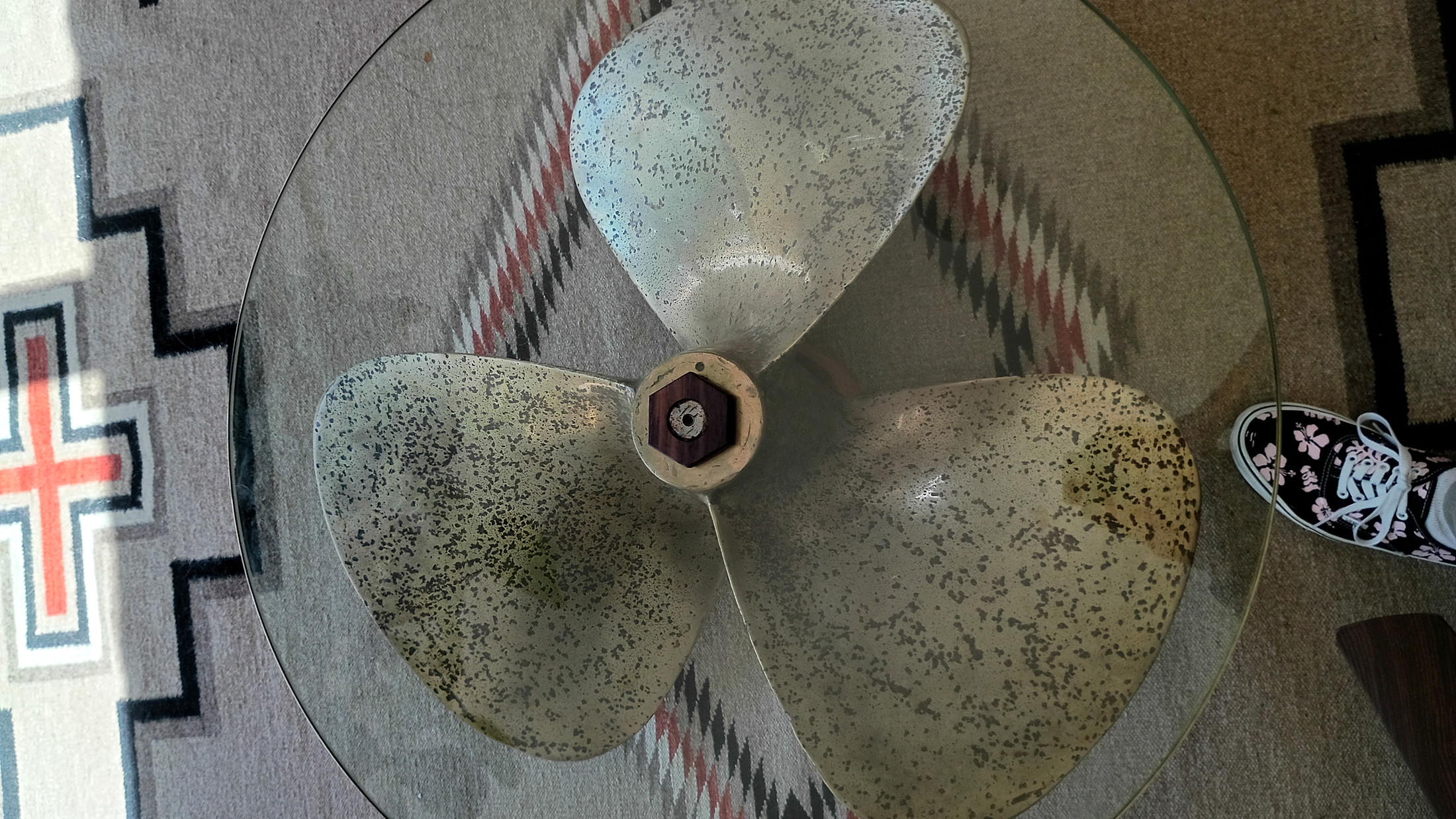 Top-down through the glass — the bronze propeller and the new hexagonal nut at the center hub