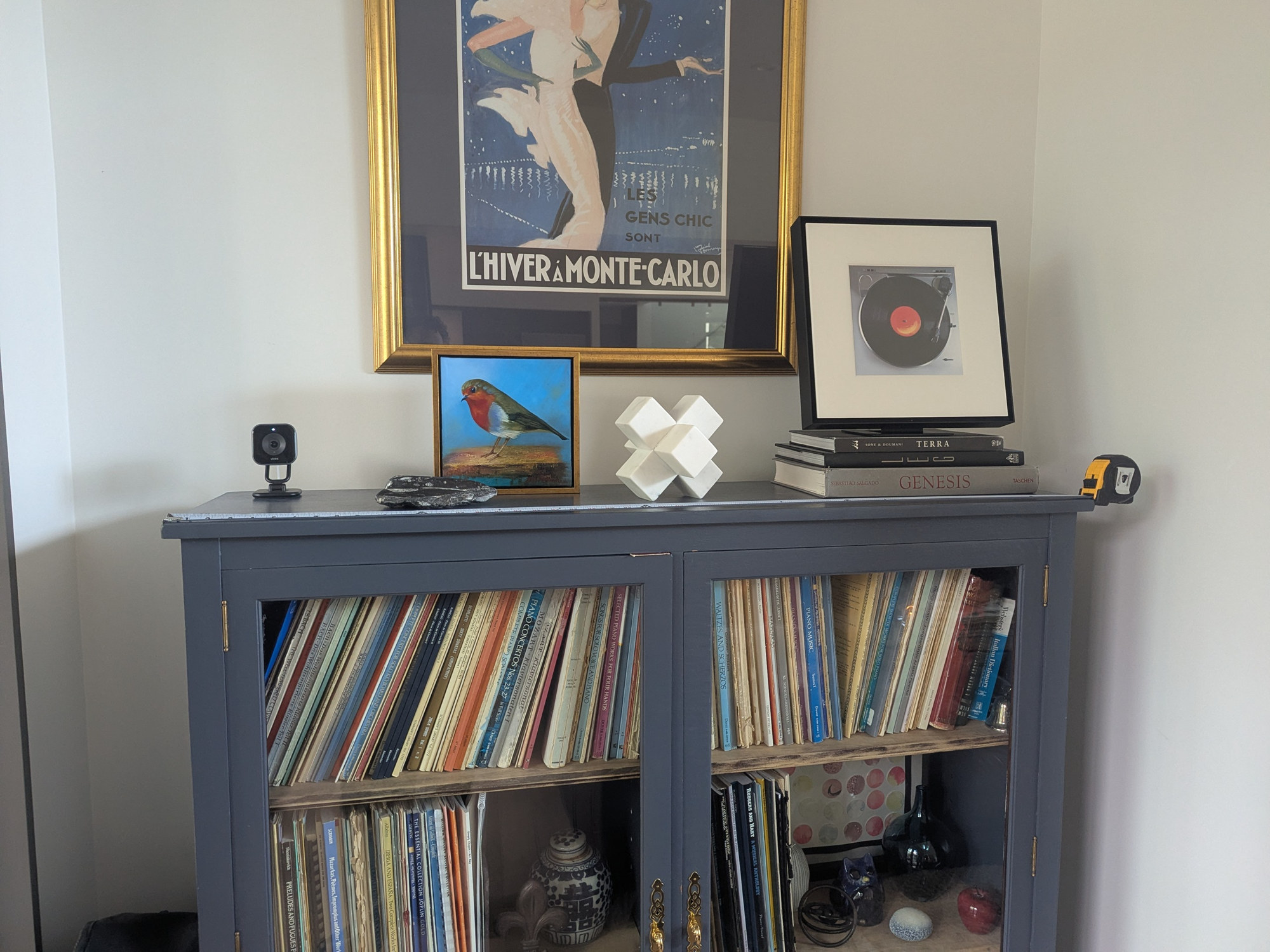 Katherine's glass-door cabinet, painted blue, full of piano scores